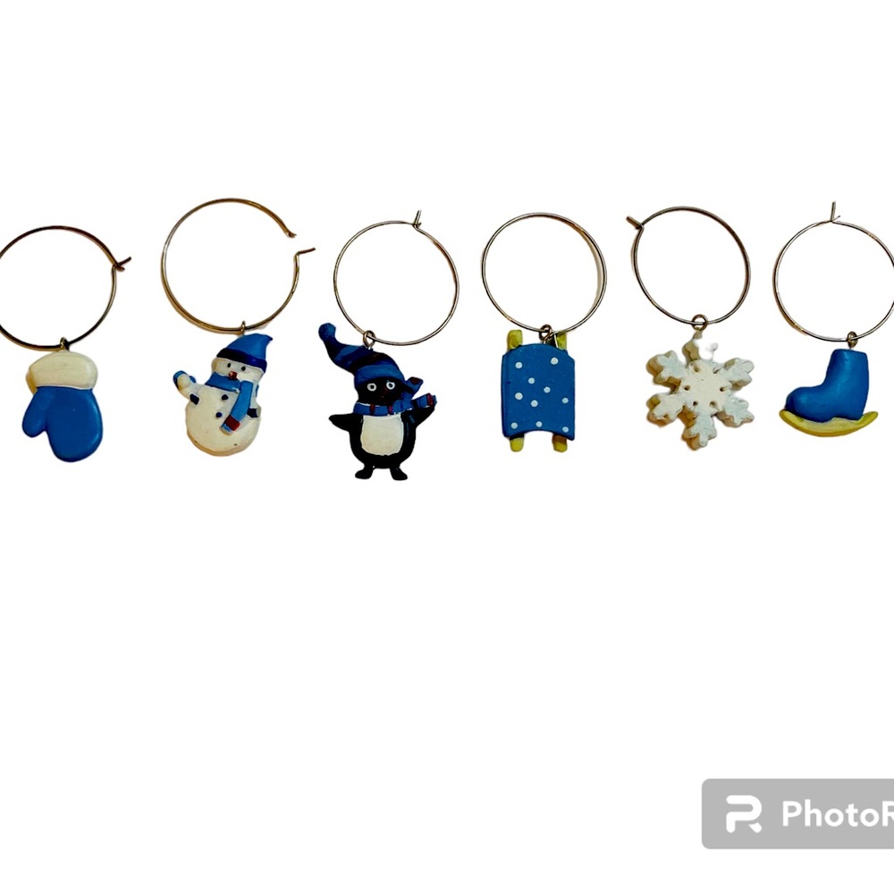 Pier 1 set of winter wine charms on blue and white snowman, sleds and more
